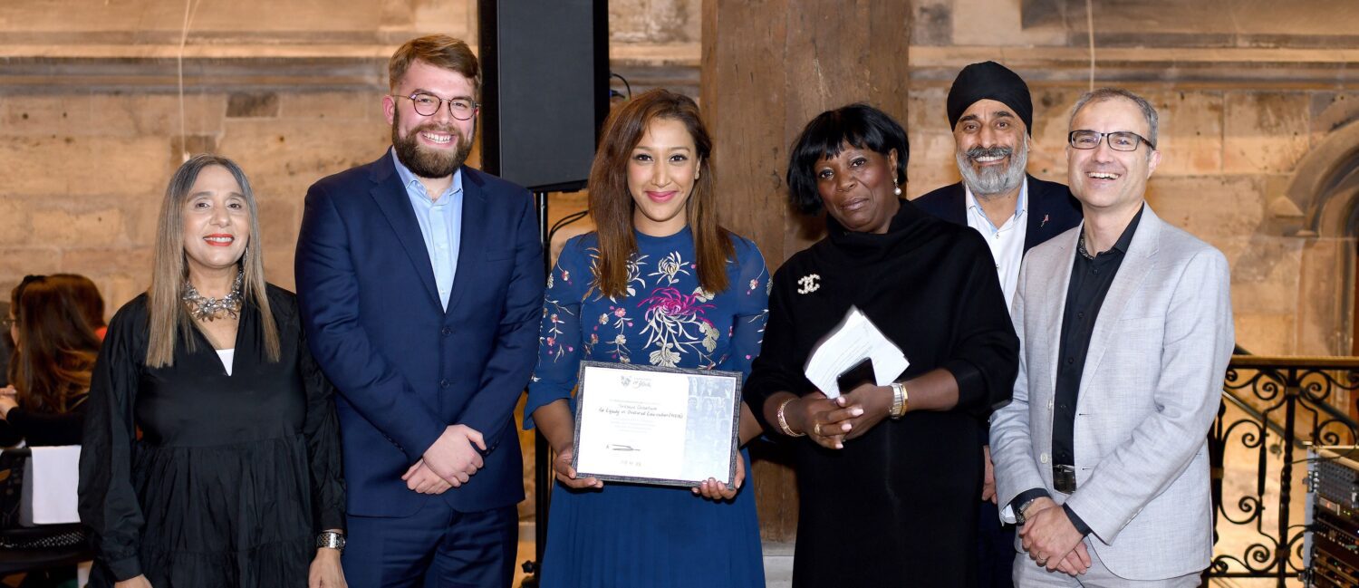 YCEDE team receiving Inclusive Impact Award